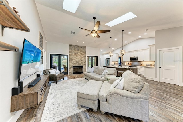 1103 134th St E, Bradenton, FL 34212 - living room with a skylight, high vaulted ceiling, wood finished floors, recessed lighting, and a ceiling fan