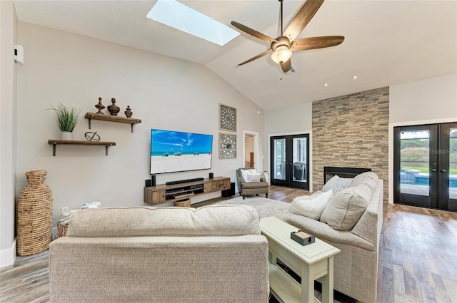 1103 134th St E, Bradenton, FL 34212 - living area featuring french doors, wood finished floors, high vaulted ceiling, and a ceiling fan
