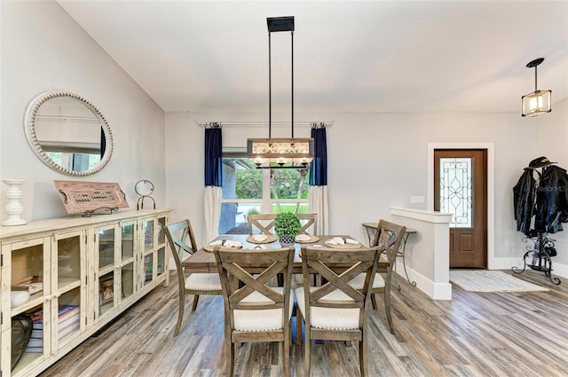 1103 134th St E, Bradenton, FL 34212 - dining space with wood finished floors, baseboards, and a chandelier