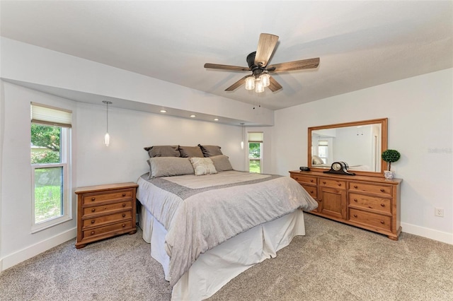 1103 134th St E, Bradenton, FL 34212 - bedroom with baseboards, light colored carpet, and ceiling fan