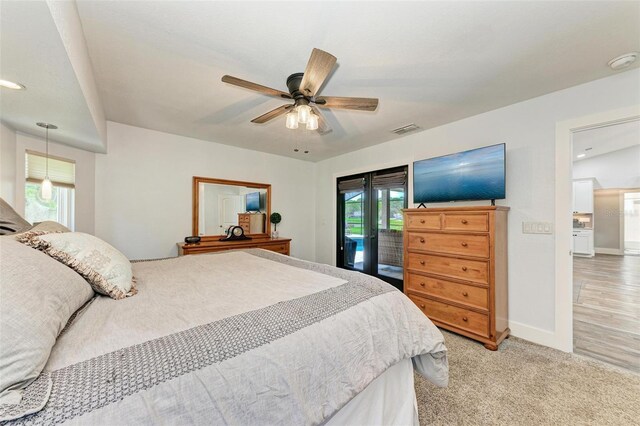 1103 134th St E, Bradenton, FL 34212 - bedroom featuring access to outside, multiple windows, baseboards, and a ceiling fan