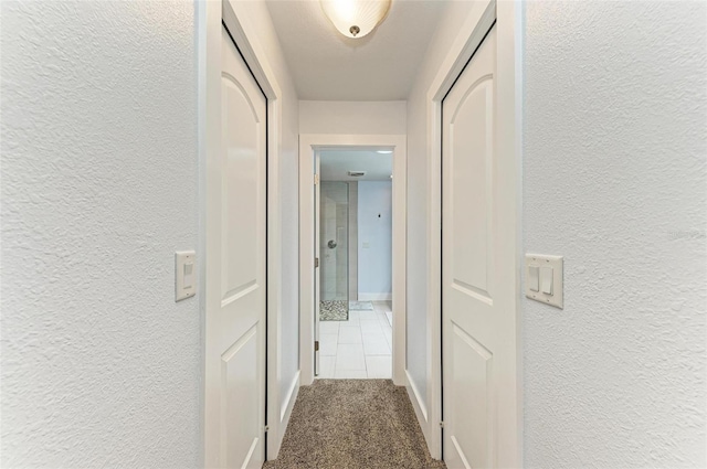 1103 134th St E, Bradenton, FL 34212 - corridor featuring a textured wall, baseboards, and carpet flooring