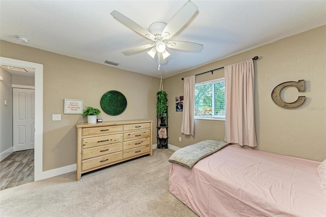 1103 134th St E, Bradenton, FL 34212 - bedroom with light carpet, a ceiling fan, and baseboards