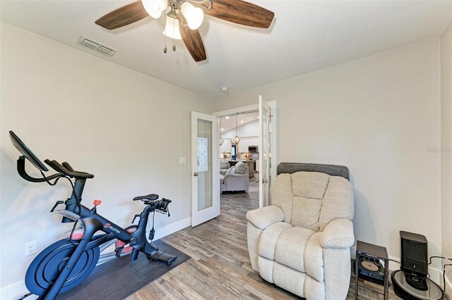 1103 134th St E, Bradenton, FL 34212 - workout area featuring wood finished floors, baseboards, ceiling fan, and french doors