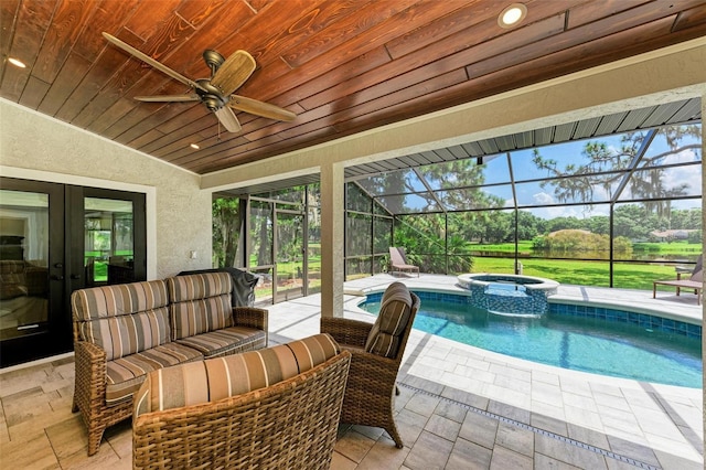 1103 134th St E, Bradenton, FL 34212 - view of swimming pool featuring a patio, french doors, a ceiling fan, a pool with connected hot tub, and outdoor lounge area
