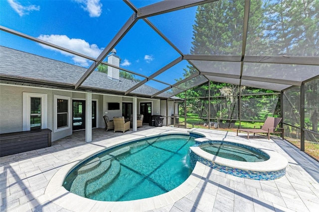 1103 134th St E, Bradenton, FL 34212 - view of pool with a patio, a pool with connected hot tub, and a lanai