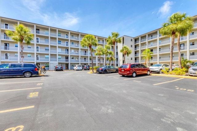 view of property with uncovered parking