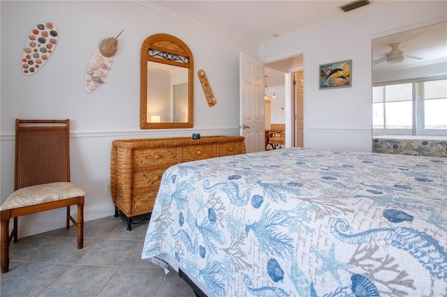 tiled bedroom featuring crown molding and visible vents