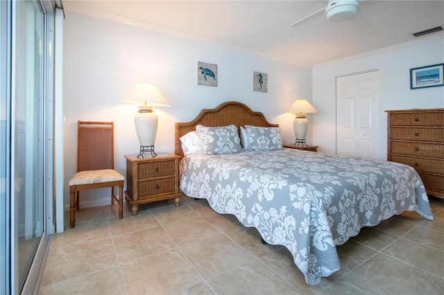 bedroom with a closet, ornamental molding, and visible vents