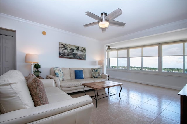 living area featuring ornamental molding, ceiling fan, tile patterned flooring, and baseboards