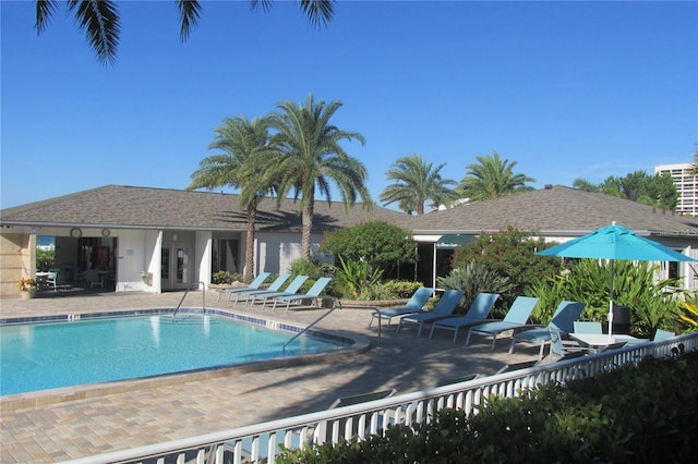 community pool featuring a patio and french doors