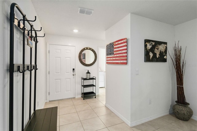 2812 Rock Sound St, Bradenton, FL 34208 - entrance foyer with light tile patterned floors, washer / dryer, baseboards, and recessed lighting