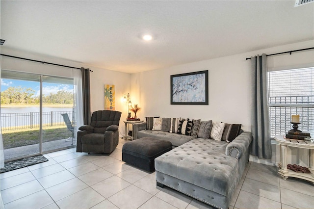 2812 Rock Sound St, Bradenton, FL 34208 - living area with light tile patterned flooring and a water view