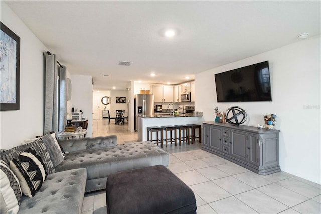 2812 Rock Sound St, Bradenton, FL 34208 - living room featuring light tile patterned flooring and recessed lighting
