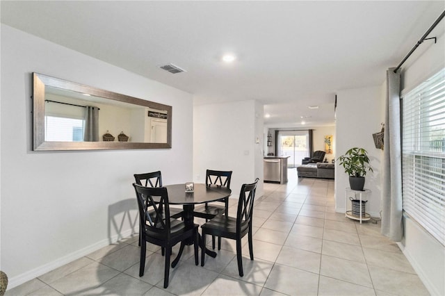 2812 Rock Sound St, Bradenton, FL 34208 - dining area with recessed lighting, healthy amount of natural light, light tile patterned floors, and baseboards
