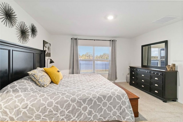 2812 Rock Sound St, Bradenton, FL 34208 - bedroom featuring light carpet, multiple windows, baseboards, and a water view