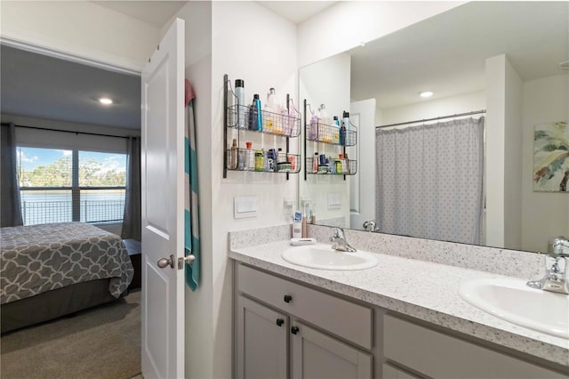 2812 Rock Sound St, Bradenton, FL 34208 - full bathroom with double vanity, a shower with shower curtain, and recessed lighting