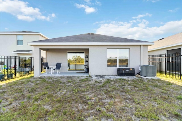 2812 Rock Sound St, Bradenton, FL 34208 - back of property featuring stucco siding, cooling unit, a fenced backyard, and a patio area