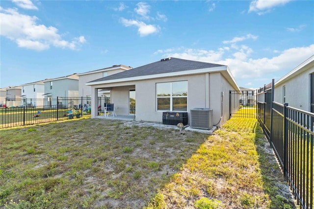 2812 Rock Sound St, Bradenton, FL 34208 - back of property with central air condition unit, stucco siding, a residential view, and roof with shingles