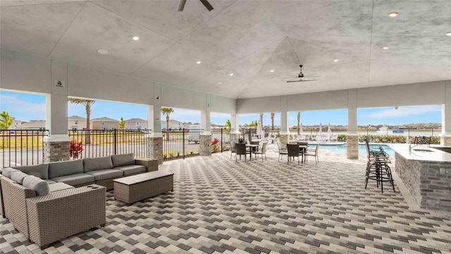2812 Rock Sound St, Bradenton, FL 34208 - view of patio / terrace featuring outdoor lounge area, a ceiling fan, and an outdoor bar