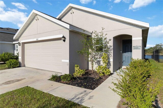 2812 Rock Sound St, Bradenton, FL 34208 - ranch-style home featuring an attached garage, stucco siding, and concrete driveway