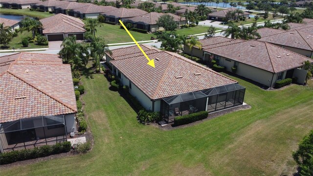 bird's eye view with a residential view and a water view