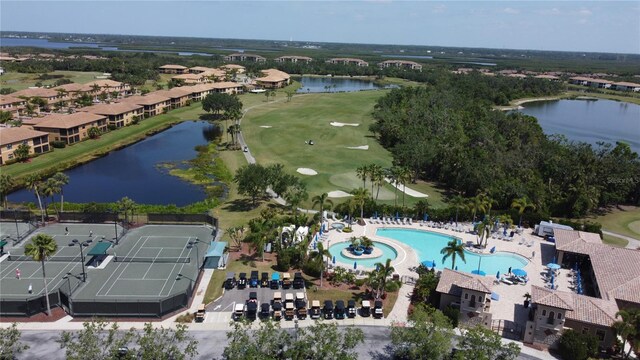 aerial view featuring a water view and view of golf course