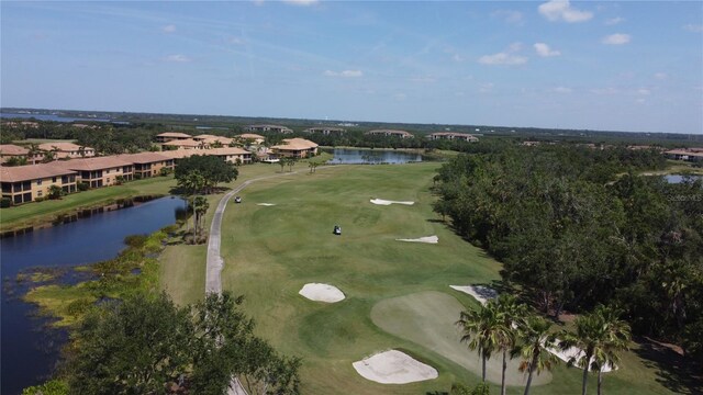 aerial view featuring a water view and view of golf course