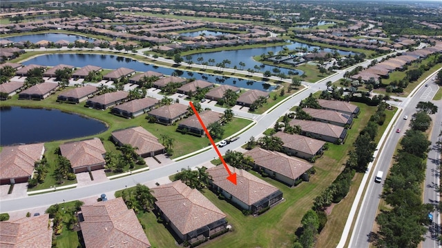aerial view with a water view and a residential view