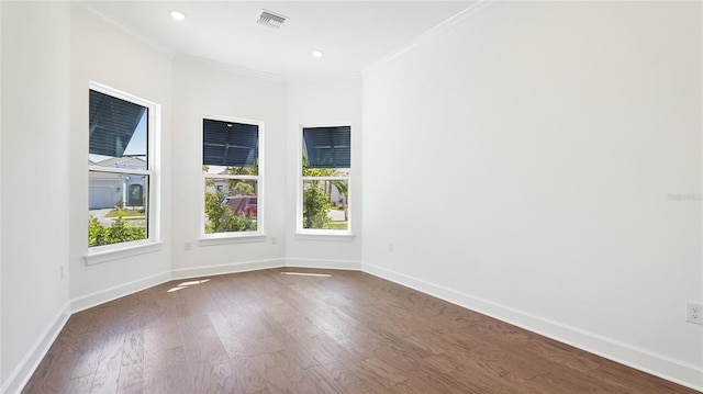 15722 San Lazzaro Ave, Lakewood Ranch, FL 34211 - empty room featuring dark wood-type flooring, crown molding, baseboards, and visible vents