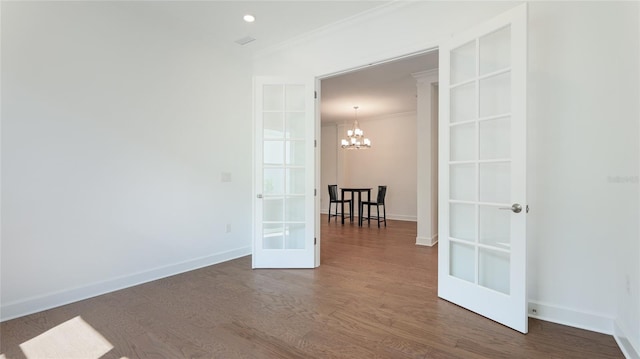 15722 San Lazzaro Ave, Lakewood Ranch, FL 34211 - empty room featuring french doors, baseboards, a notable chandelier, and wood finished floors