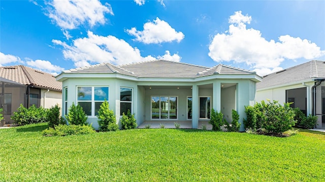 15722 San Lazzaro Ave, Lakewood Ranch, FL 34211 - back of property with a tiled roof, stucco siding, and a lawn