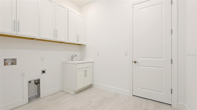 15722 San Lazzaro Ave, Lakewood Ranch, FL 34211 - washroom featuring hookup for a washing machine, electric dryer hookup, a sink, baseboards, and cabinet space