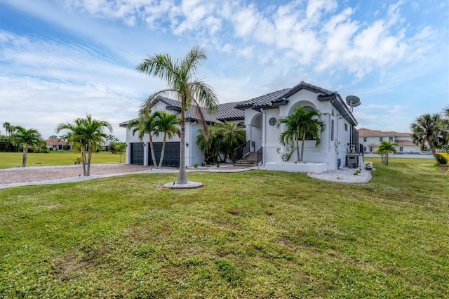 24017 Peppercorn Rd, Punta Gorda, FL 33955 - mediterranean / spanish-style home with a tiled roof, a garage, stucco siding, a front lawn, and driveway