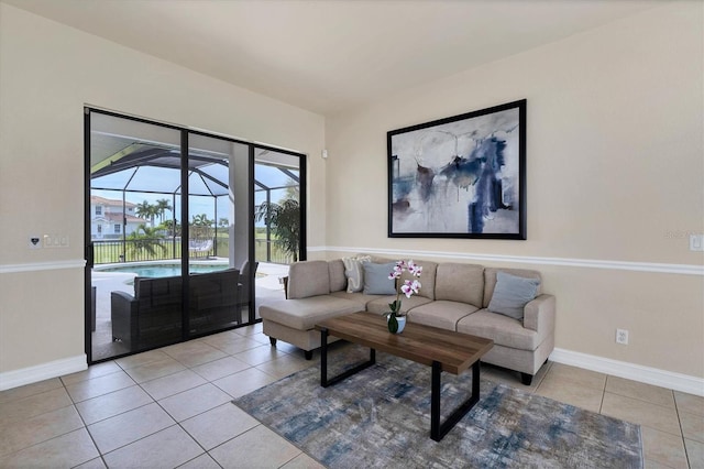 24017 Peppercorn Rd, Punta Gorda, FL 33955 - living area featuring light tile patterned flooring and baseboards