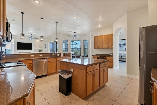 24017 Peppercorn Rd, Punta Gorda, FL 33955 - kitchen with ceiling fan, light tile patterned floors, and stainless steel appliances