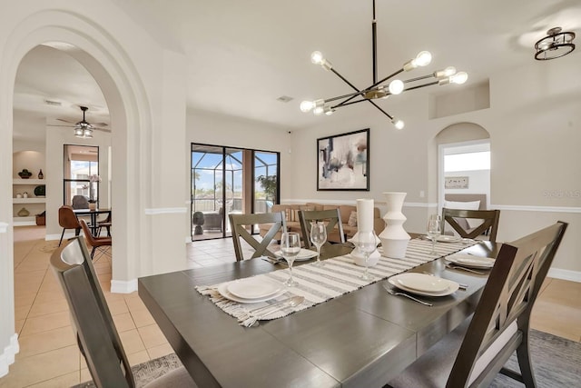 24017 Peppercorn Rd, Punta Gorda, FL 33955 - dining area featuring arched walkways, light tile patterned floors, and a wealth of natural light