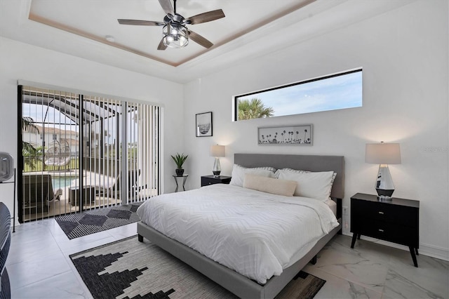 24017 Peppercorn Rd, Punta Gorda, FL 33955 - bedroom with access to outside, multiple windows, a tray ceiling, and baseboards