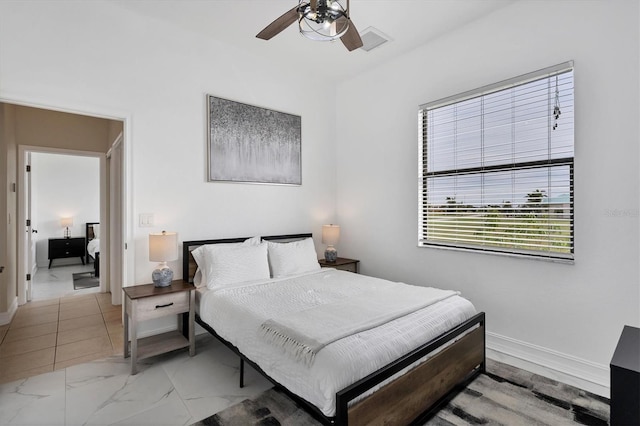 24017 Peppercorn Rd, Punta Gorda, FL 33955 - bedroom with marble finish floor, baseboards, a ceiling fan, and visible vents