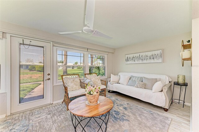 1622 Stafford Ln Unit 1205, Sarasota, FL 34232 - living room featuring wood finished floors, a ceiling fan, and baseboards