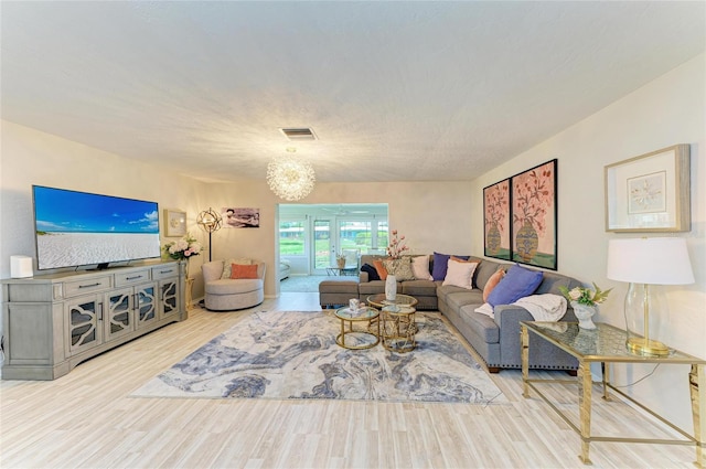 1622 Stafford Ln Unit 1205, Sarasota, FL 34232 - living room with wood finished floors and visible vents