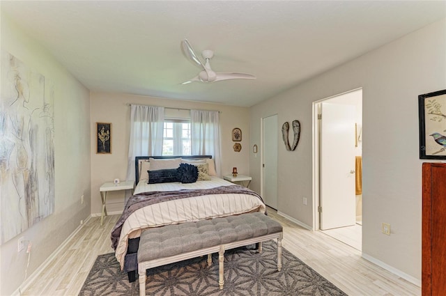 1622 Stafford Ln Unit 1205, Sarasota, FL 34232 - bedroom with connected bathroom, ceiling fan, baseboards, and light wood finished floors
