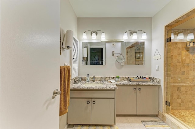 1622 Stafford Ln Unit 1205, Sarasota, FL 34232 - bathroom with vanity, tile patterned flooring, and a stall shower