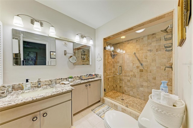 1622 Stafford Ln Unit 1205, Sarasota, FL 34232 - bathroom featuring a shower stall, toilet, vanity, and tile patterned floors