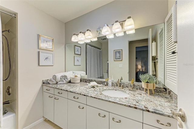 1622 Stafford Ln Unit 1205, Sarasota, FL 34232 - full bathroom with baseboards, vanity, visible vents, and shower / bathtub combination with curtain