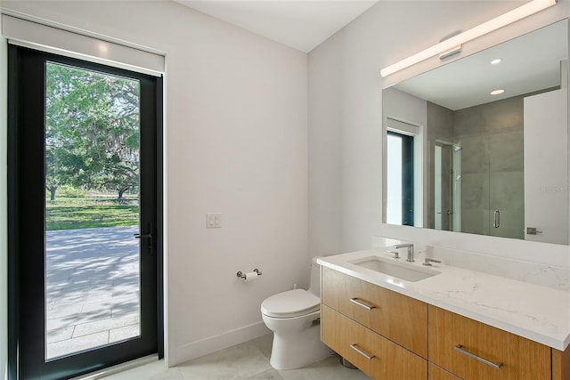 7200 Chameleon Way, Sarasota, FL 34241 - full bath featuring a stall shower, toilet, vanity, tile patterned floors, and baseboards
