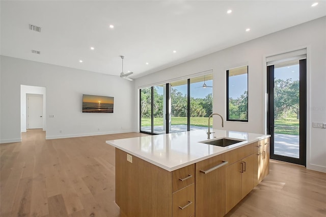 7200 Chameleon Way, Sarasota, FL 34241 - kitchen featuring ceiling fan, an island with sink, modern cabinets, light wood finished floors, and recessed lighting