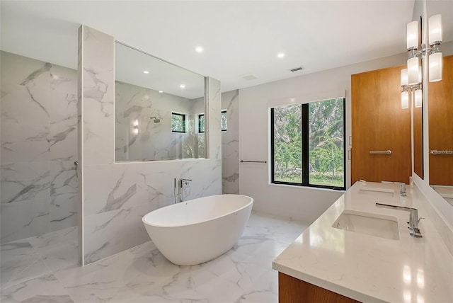 7200 Chameleon Way, Sarasota, FL 34241 - full bath with double vanity, a marble finish shower, a freestanding tub, marble tiled floors, and recessed lighting