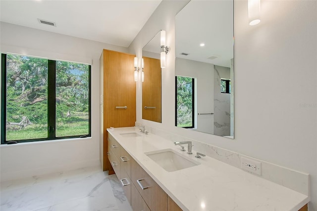 7200 Chameleon Way, Sarasota, FL 34241 - bathroom with plenty of natural light, double vanity, and marble finish floors