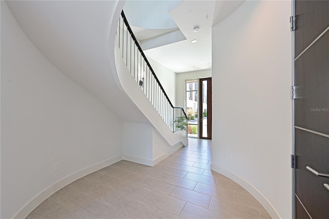 221 Cosmopolitan Ct, Sarasota, FL 34236 - foyer featuring baseboards, stairs, and light tile patterned floors